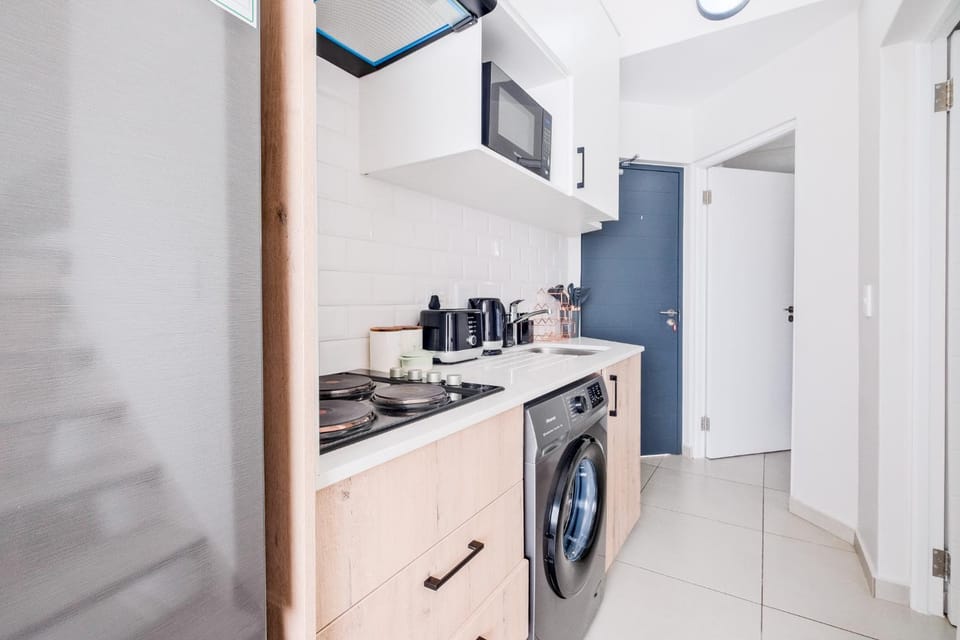 Kitchen or kitchenette, toaster, washing machine