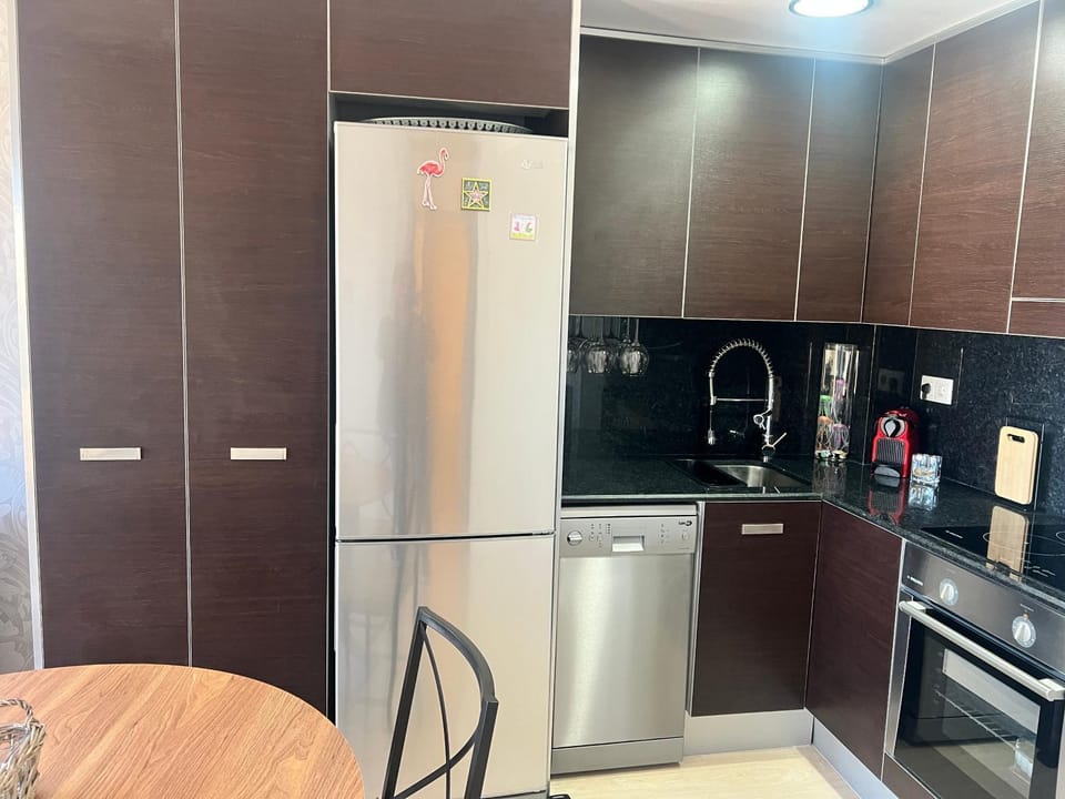Kitchen or kitchenette, dishwasher, oven, stove, toaster