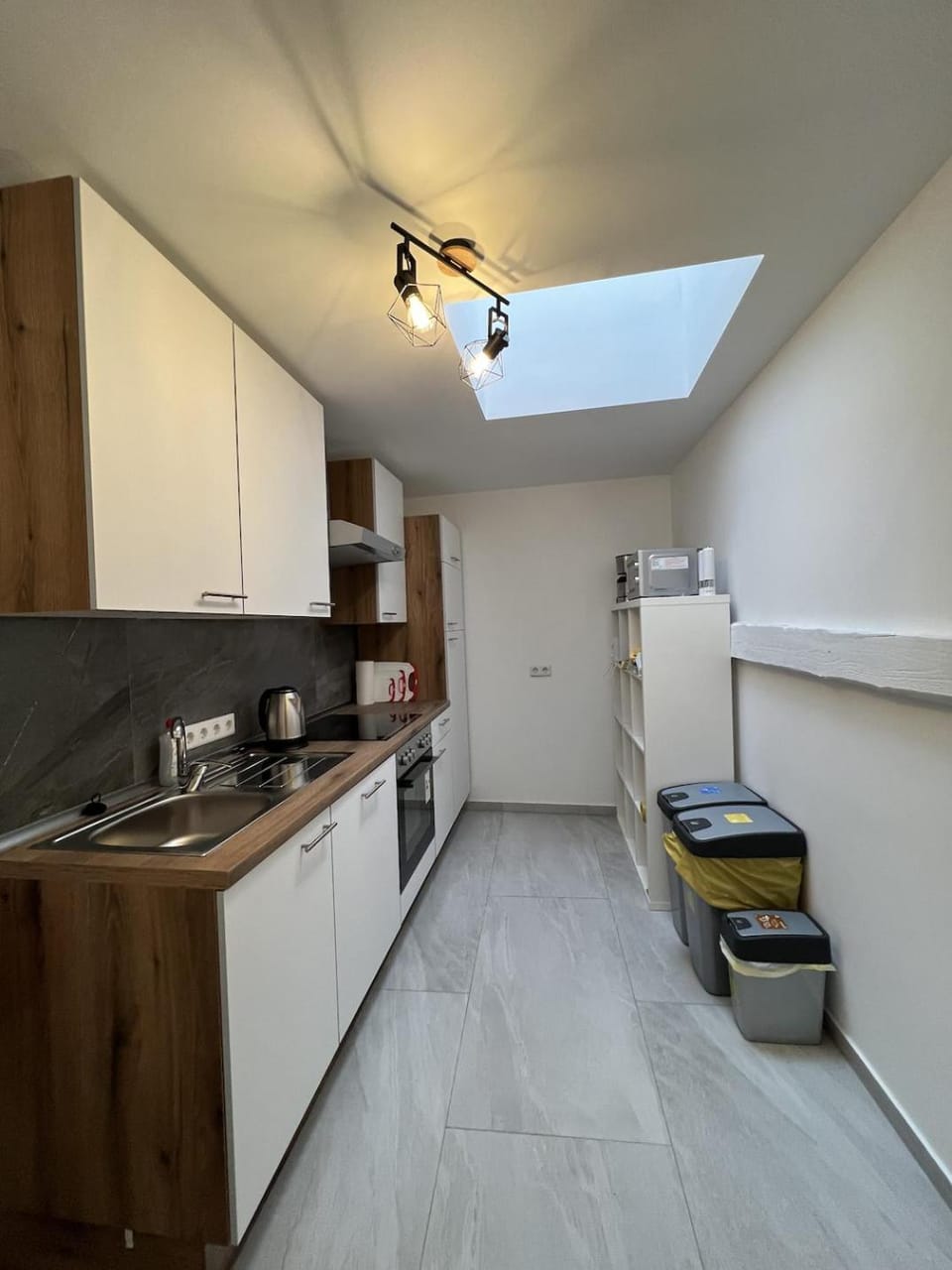 Kitchen or kitchenette, dishwasher, oven, stove