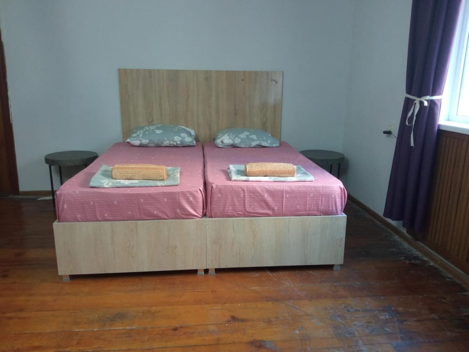 large bedroom with two separate beds Bed and Breakfast in Georgia