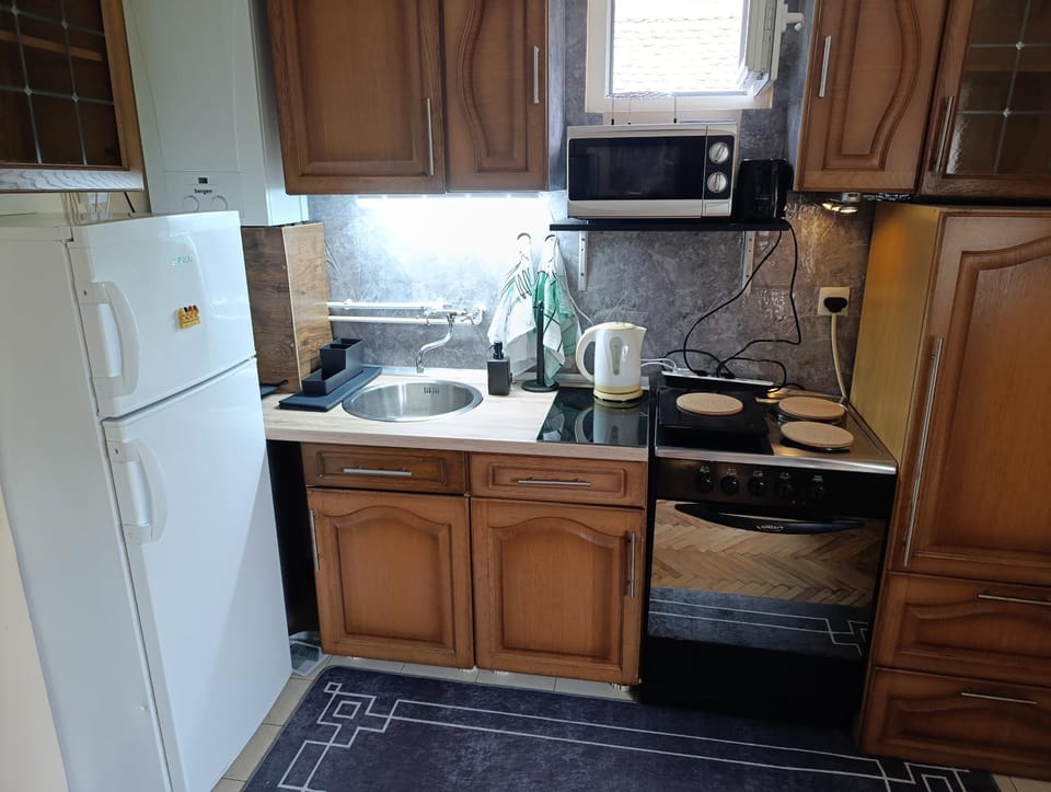 Kitchen or kitchenette, microwave, oven, stove, toaster