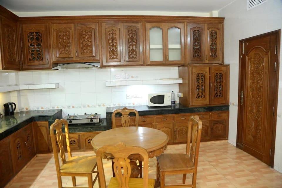 Kitchen or kitchenette, microwave, stove, toaster