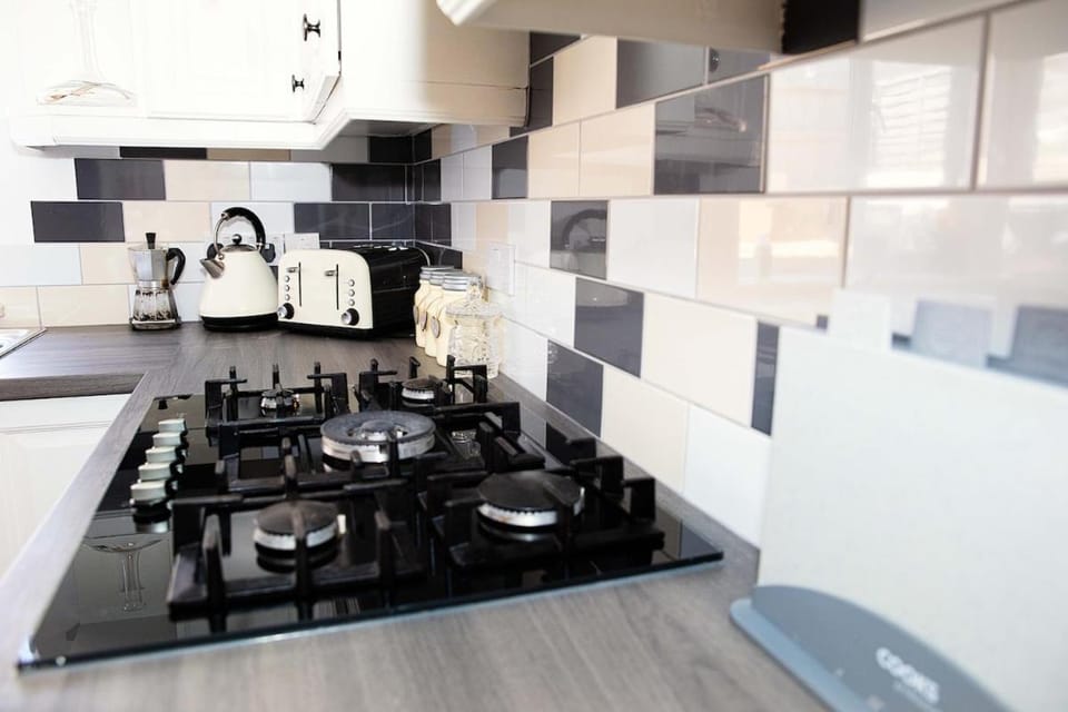 Kitchen or kitchenette, stove, toaster