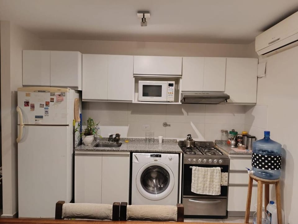 Kitchen or kitchenette, oven, stove, washing machine