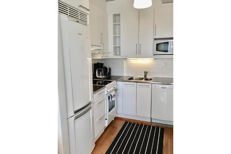 Kitchen or kitchenette, dishwasher, oven, stove
