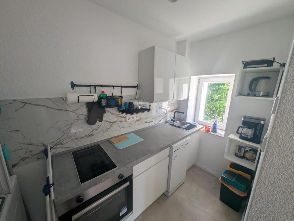 Kitchen or kitchenette, dishwasher, oven, stove, toaster
