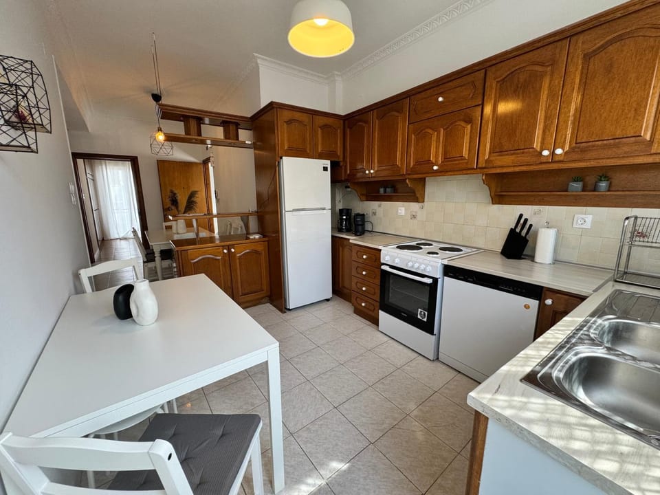 Kitchen or kitchenette, dishwasher, oven, stove