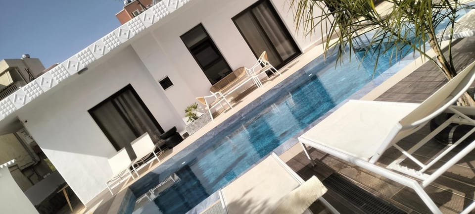Property building, Living room, Swimming pool