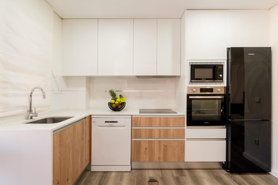 Kitchen or kitchenette, dishwasher, oven, stove, toaster