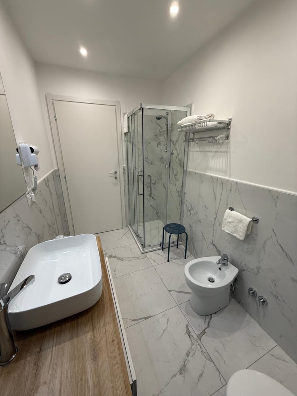 Shower, Toilet, Bathroom, bidet, hair dryier, towels