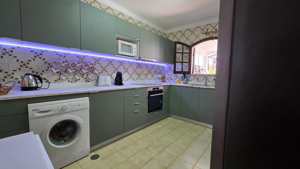 Kitchen or kitchenette, stove, washing machine