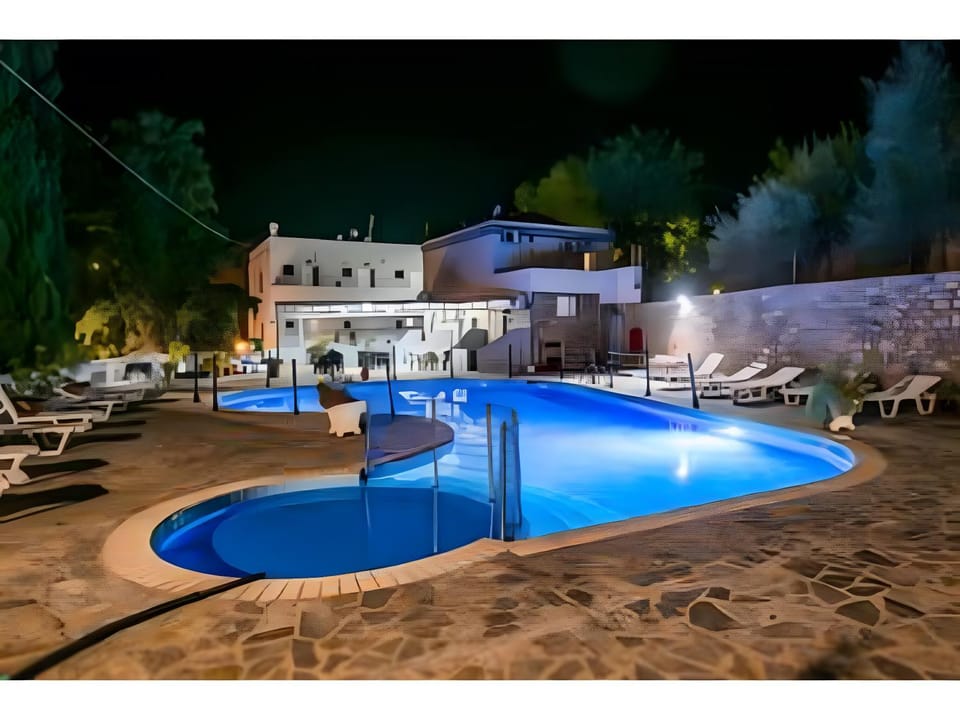 Property building, Living room, Swimming pool