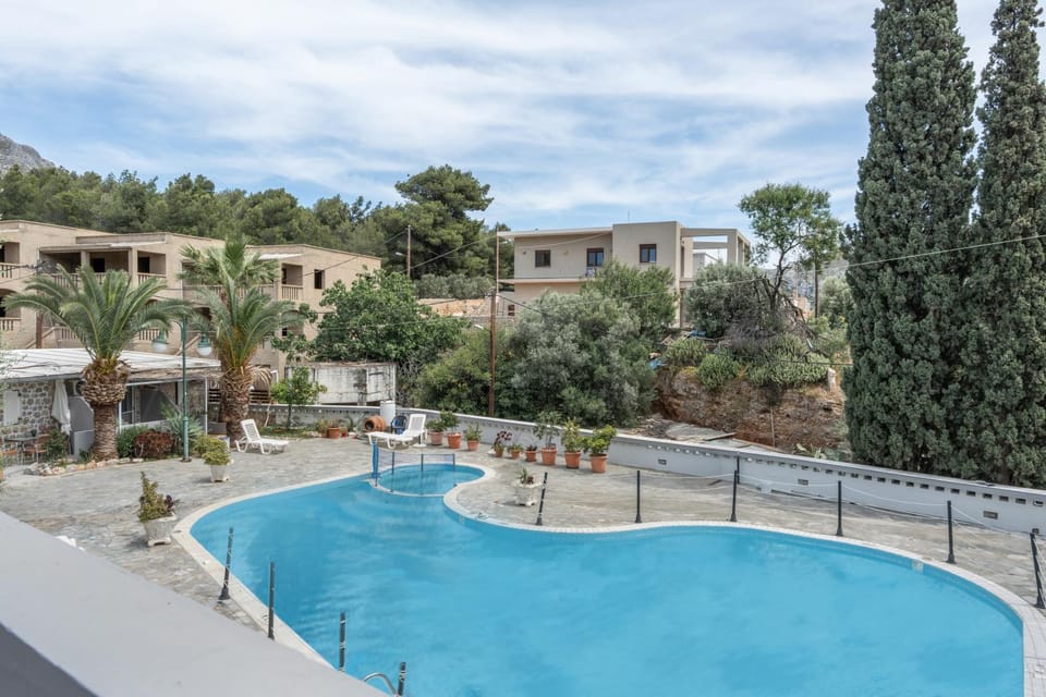 Property building, Living room, Swimming pool