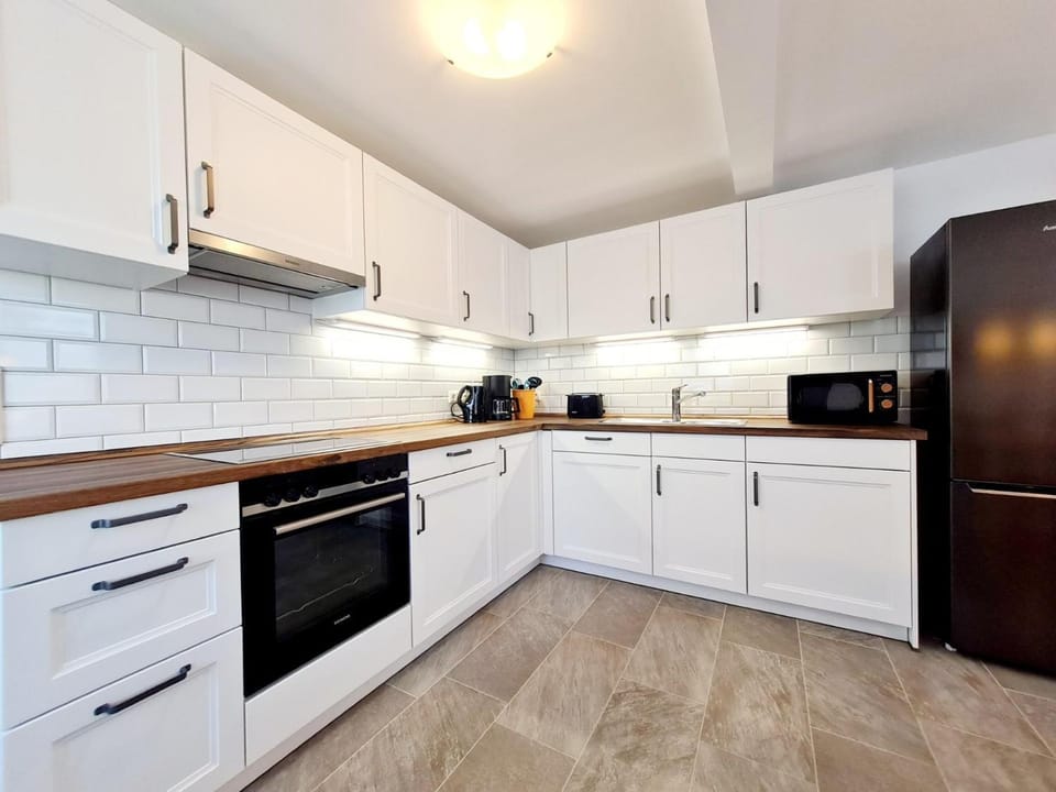 Kitchen or kitchenette, dishwasher, oven, stove, toaster
