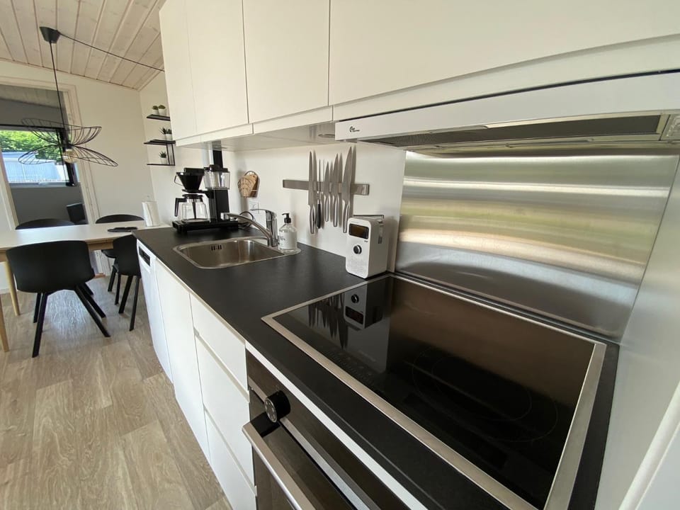 Kitchen or kitchenette, dishwasher, oven, stove
