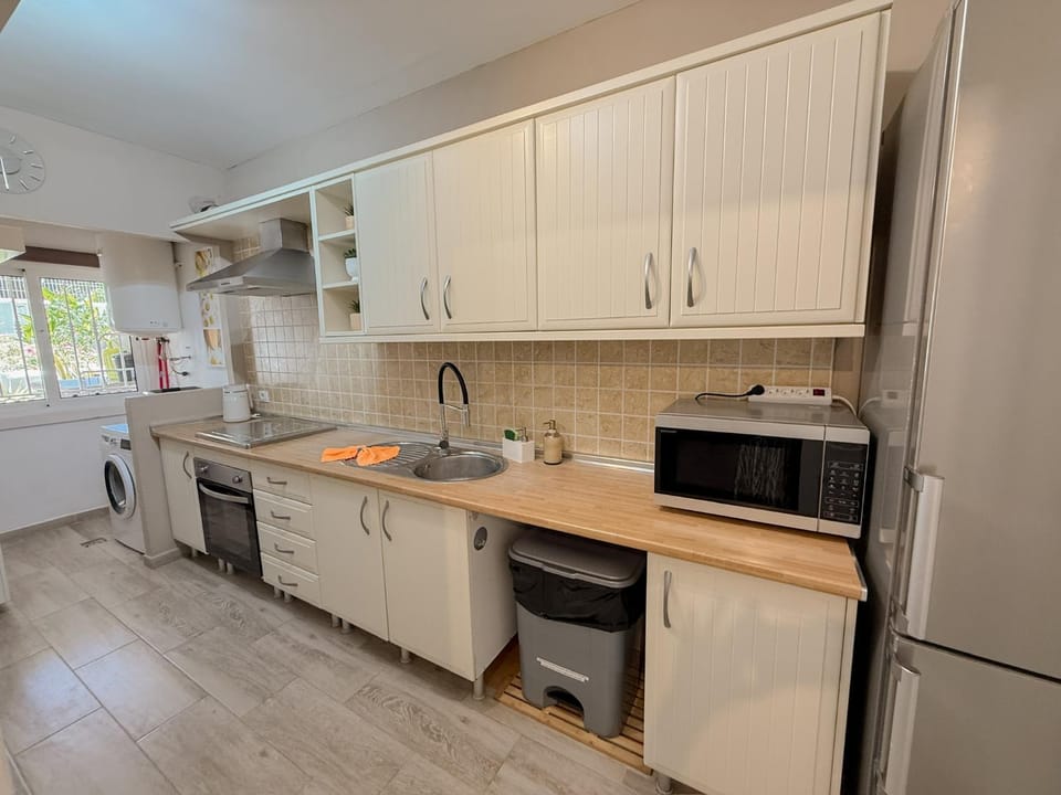 Kitchen or kitchenette, dishwasher, oven, stove, toaster