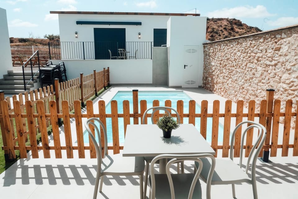 Property building, Patio, Day, View (from property/room), Balcony/Terrace, Dining area, Pool view, Swimming pool