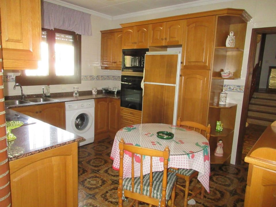 Kitchen or kitchenette, washing machine