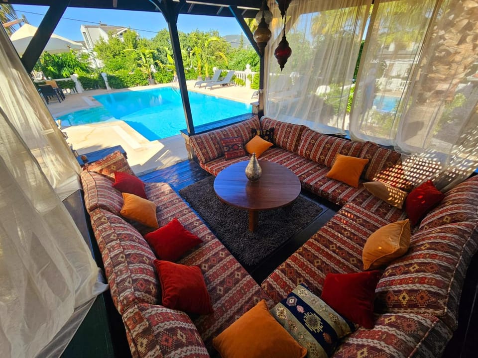 View (from property/room), Balcony/Terrace, Seating area, Swimming pool