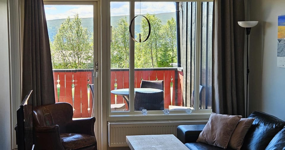 TV and multimedia, View (from property/room), Living room, Seating area, Mountain view