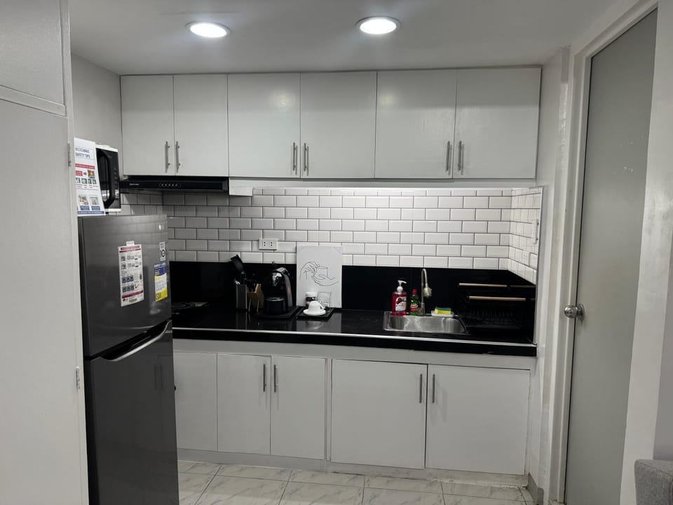 Kitchen or kitchenette, dishwasher, oven, stove