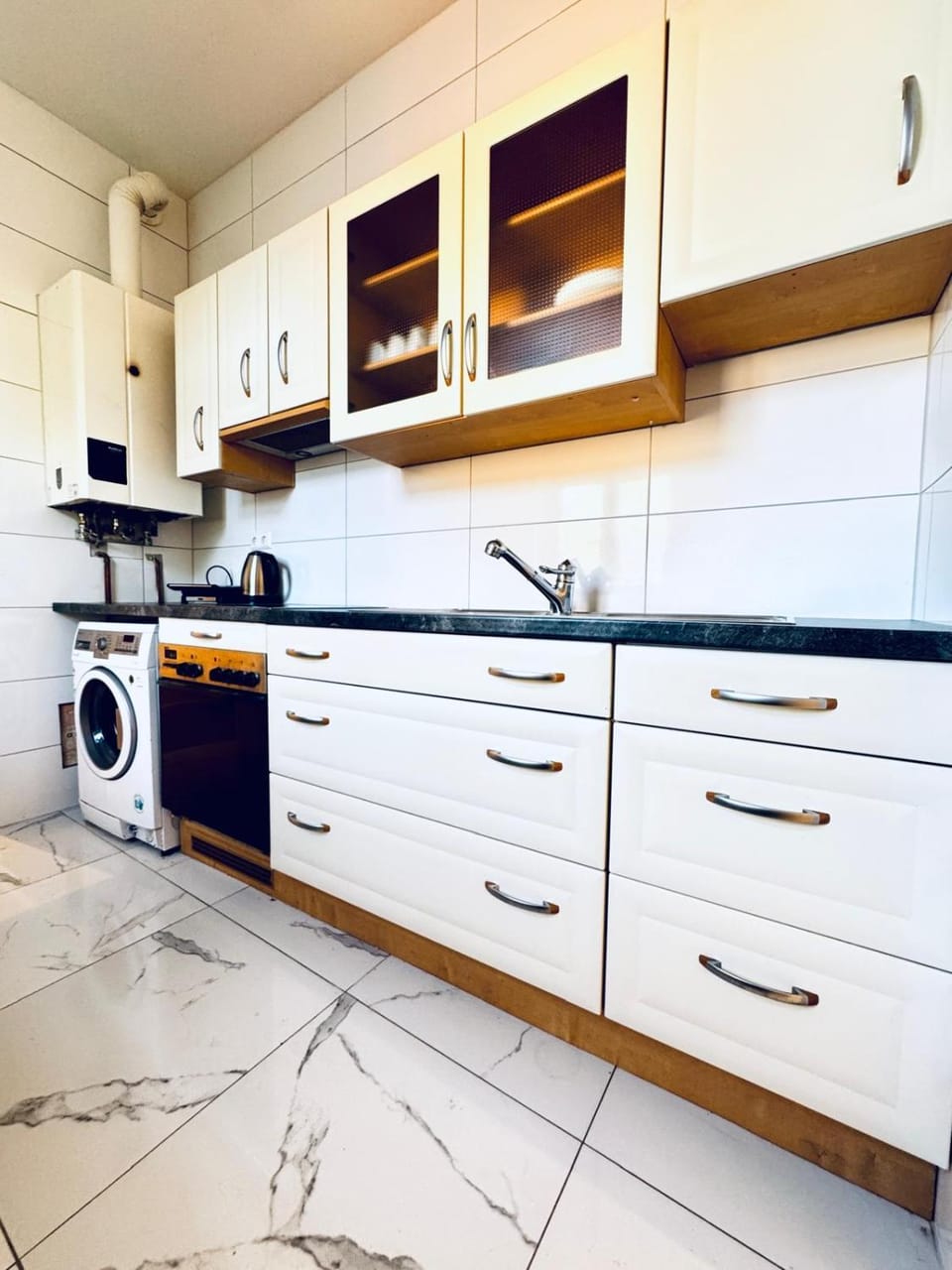 Kitchen or kitchenette, washing machine