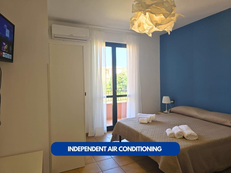 Bed, Photo of the whole room, Bedroom, towels, air conditioner