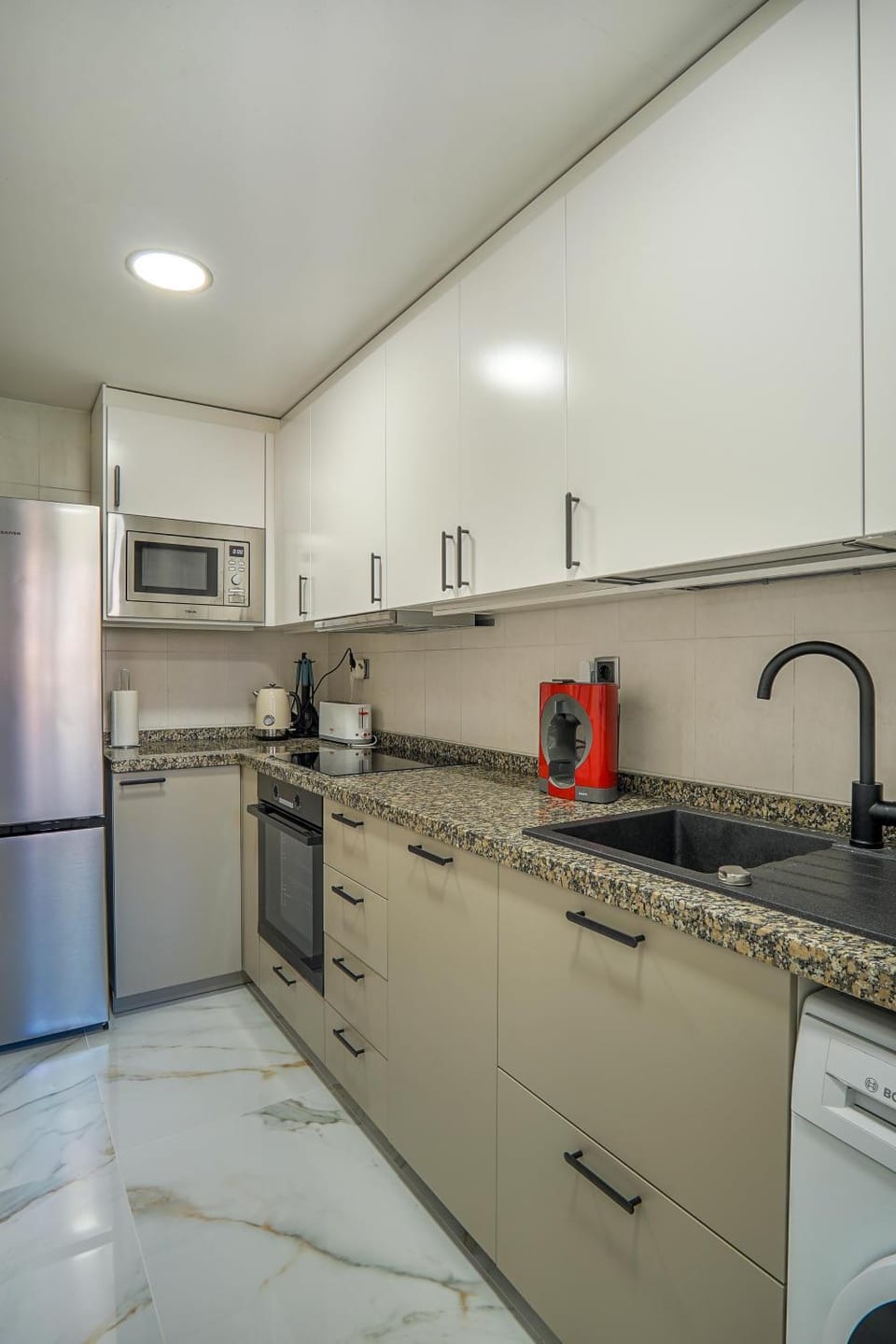 Kitchen or kitchenette, dishwasher, oven, toaster