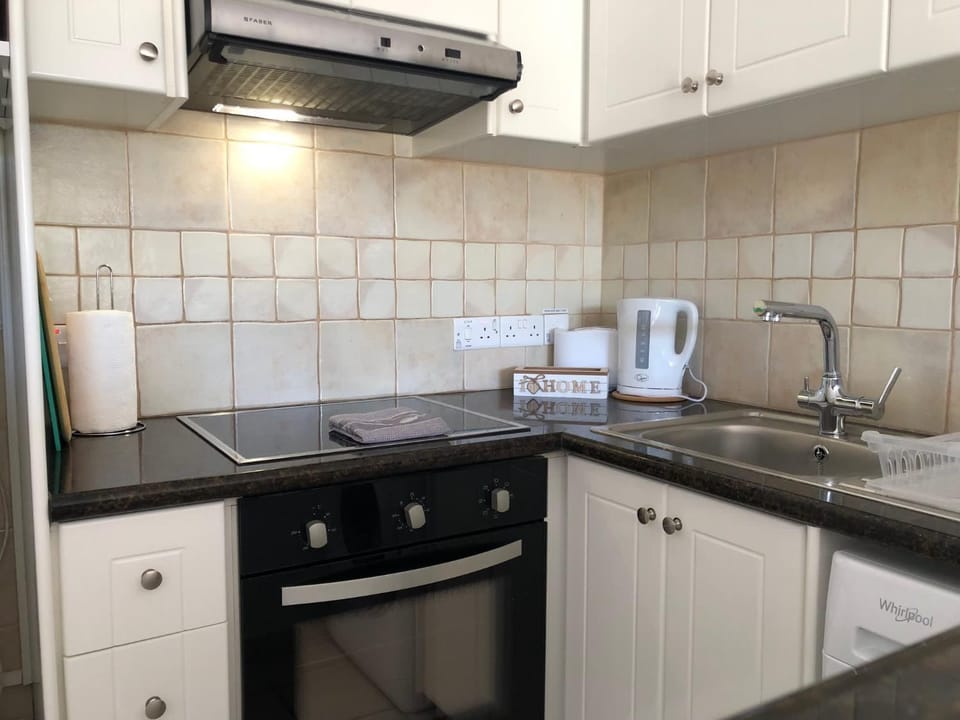 Kitchen or kitchenette, stove, toaster