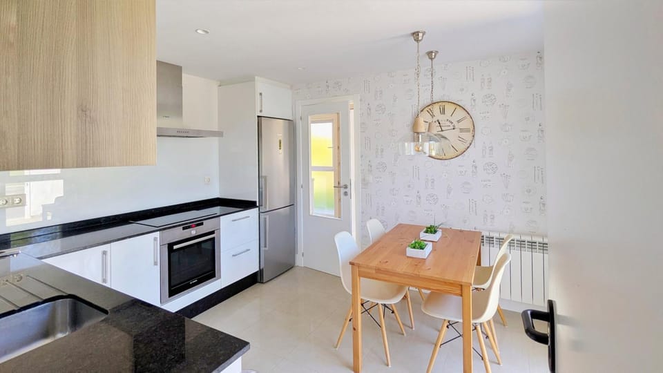 Kitchen or kitchenette, dishwasher, oven, stove