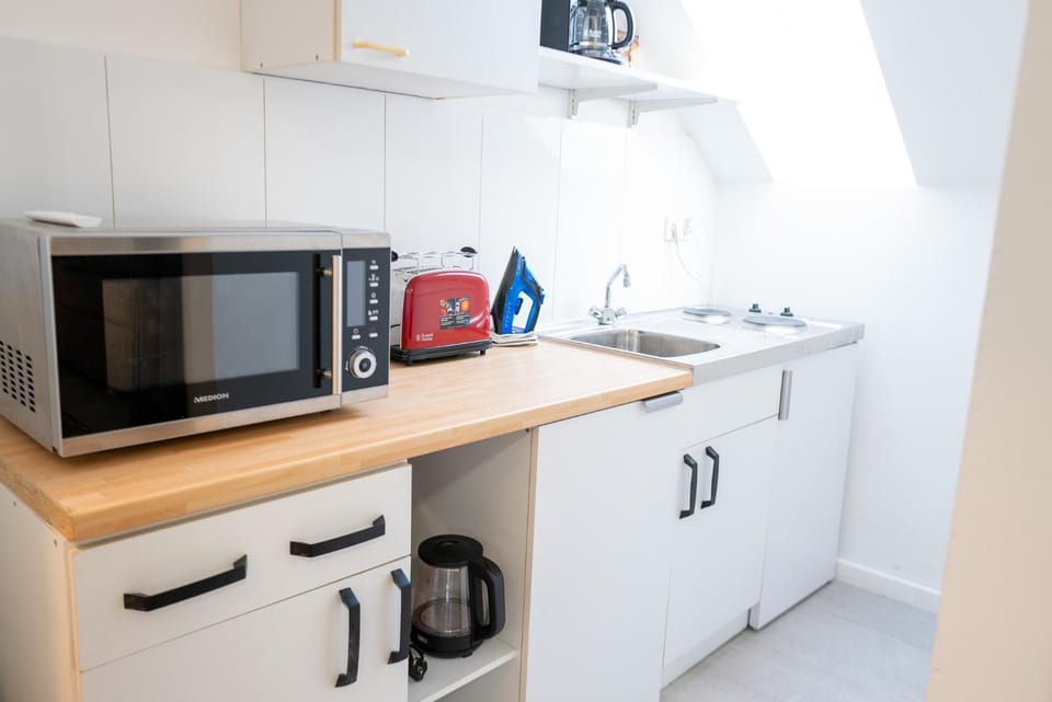 Kitchen or kitchenette, stove, toaster