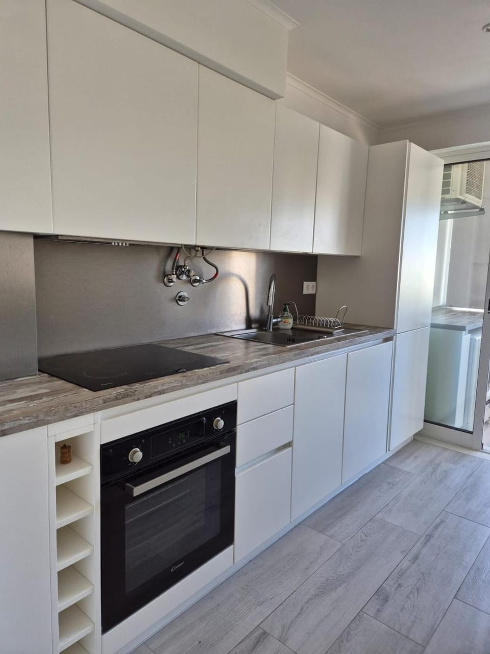 Kitchen or kitchenette, dishwasher, oven, stove