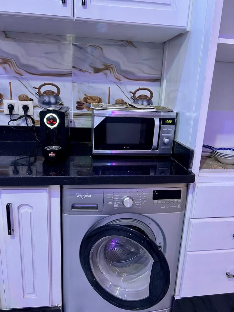 Kitchen or kitchenette, dishwasher, stove, washing machine, dryer