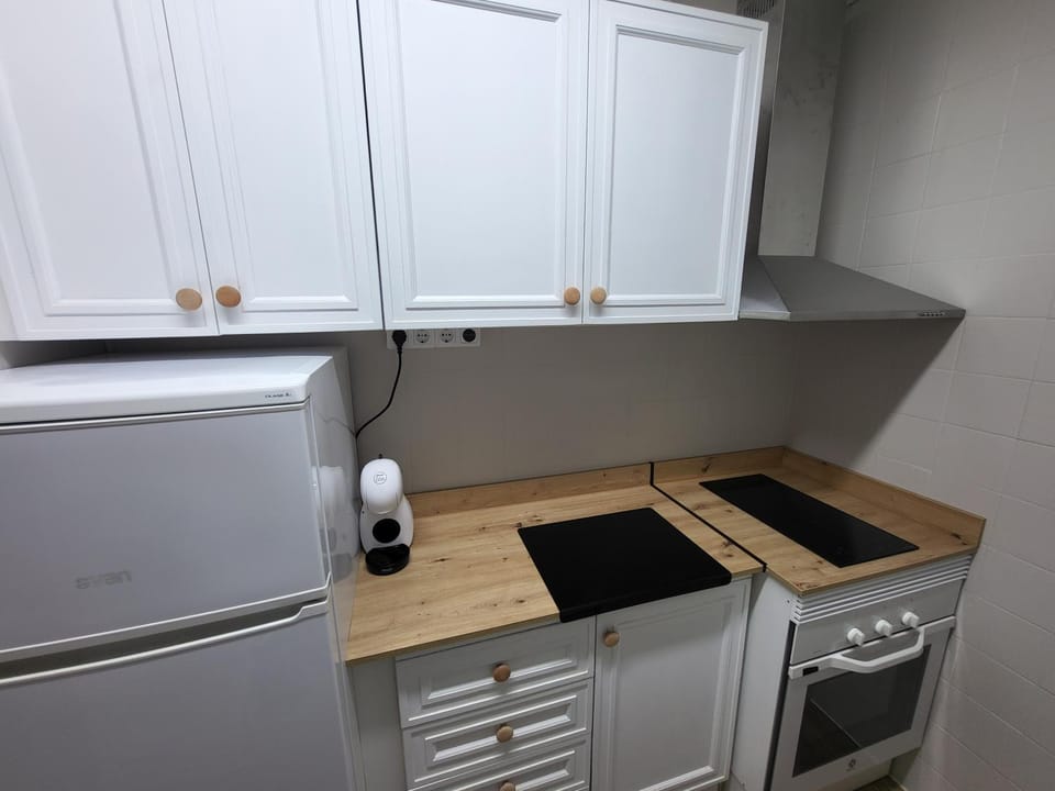 Kitchen or kitchenette, oven, stove