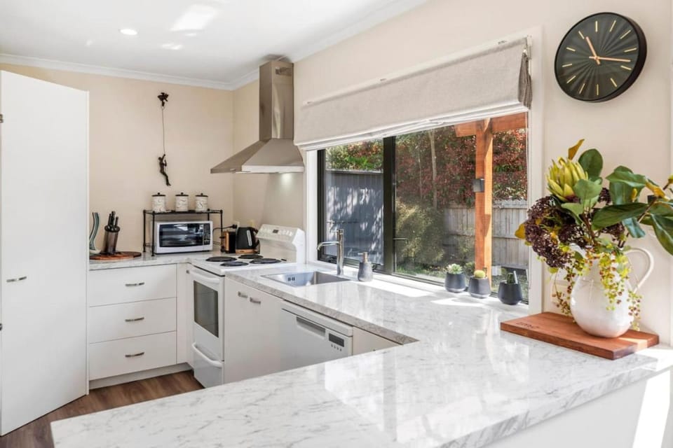 Kitchen or kitchenette, dishwasher, microwave, oven, stove