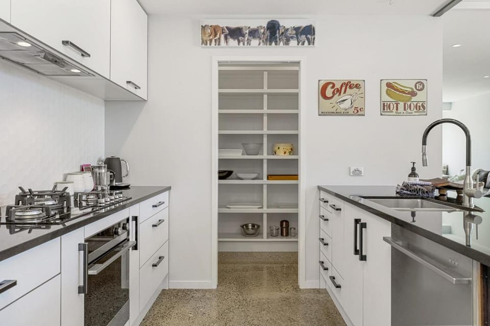Kitchen or kitchenette, dishwasher, oven, stove