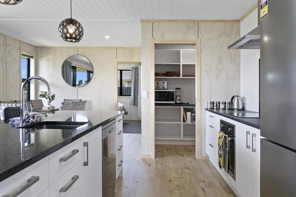 Kitchen or kitchenette, dishwasher, oven, stove