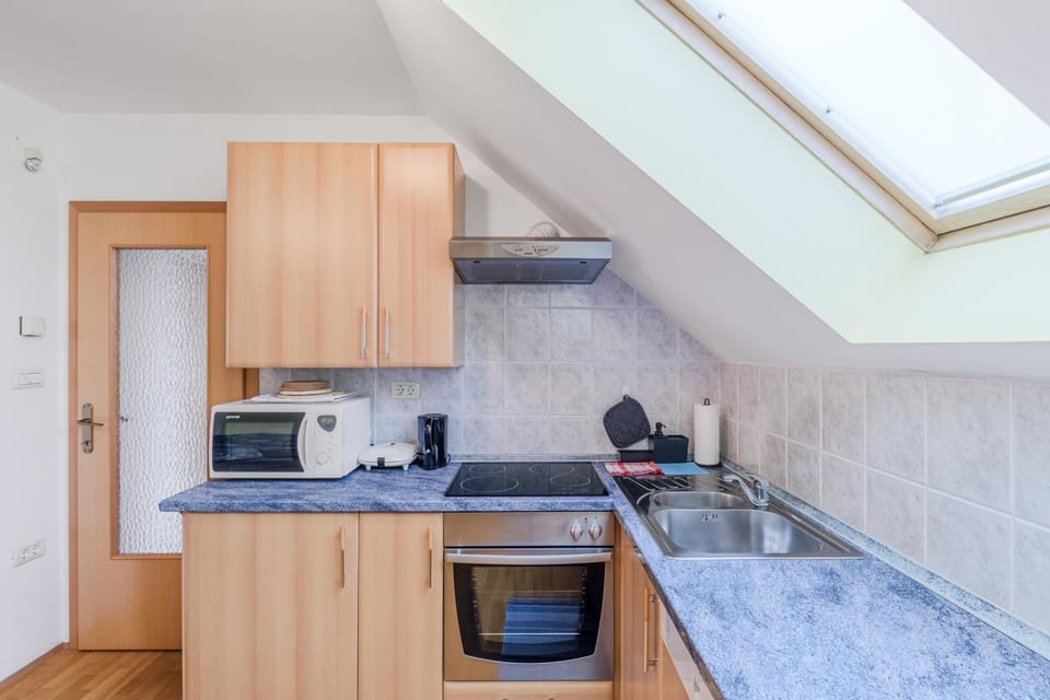 Kitchen or kitchenette, dishwasher, microwave, oven, stove, toaster, kitchen