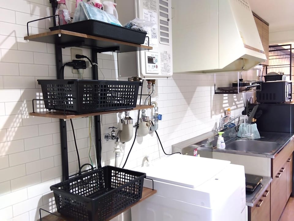 Kitchen or kitchenette, washing machine