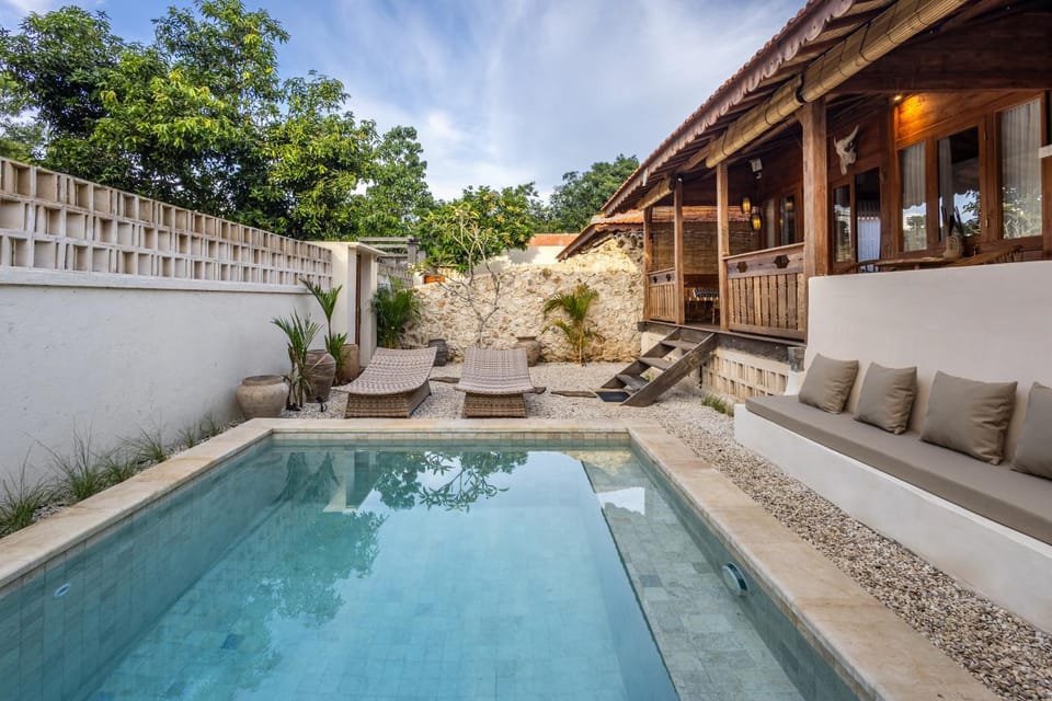 Property building, Patio, Day, Natural landscape, Seating area, Pool view, Swimming pool, sunbed