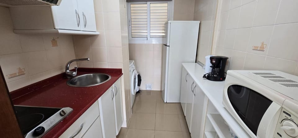 Kitchen or kitchenette, washing machine
