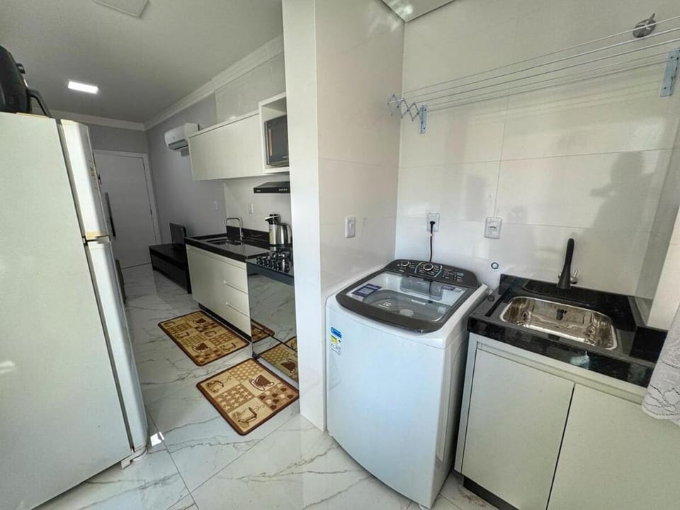 Kitchen or kitchenette, washing machine