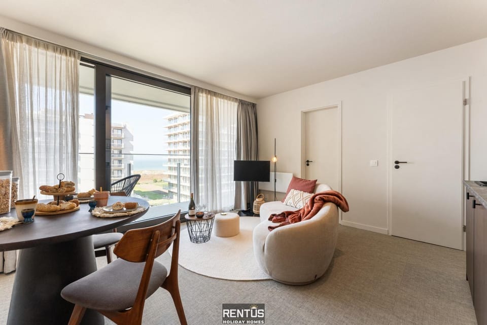 View (from property/room), Living room, Seating area, Dining area, Sea view