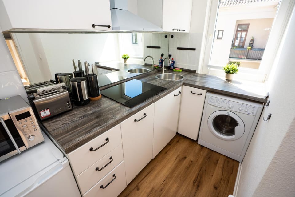 Kitchen or kitchenette, oven, stove, washing machine