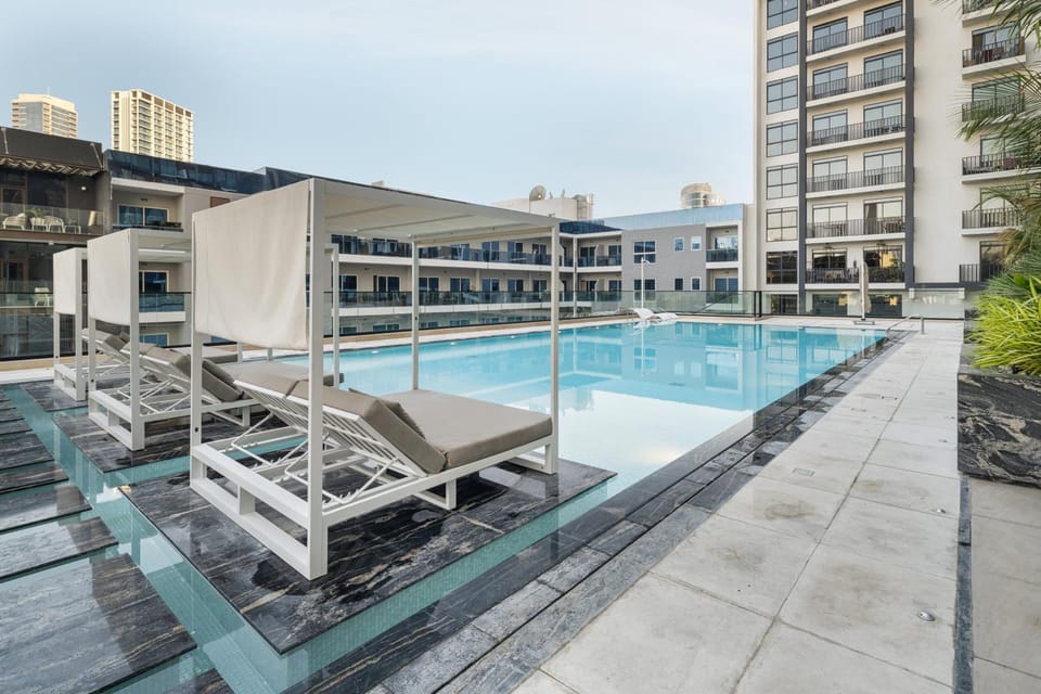 Luxury 1BR JVC Pool & Balcony by Circle Mall Apartment in Dubai