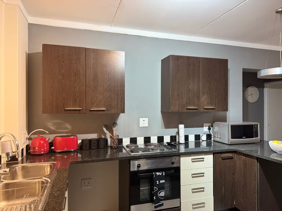 Kitchen or kitchenette, stove, toaster