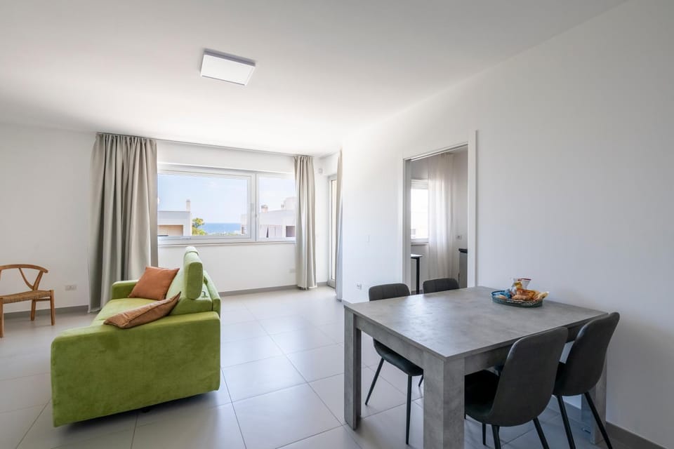 Bed, Living room, Seating area, Dining area, Sea view