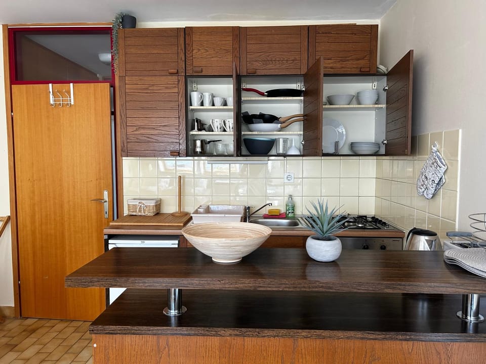 Kitchen or kitchenette, stove