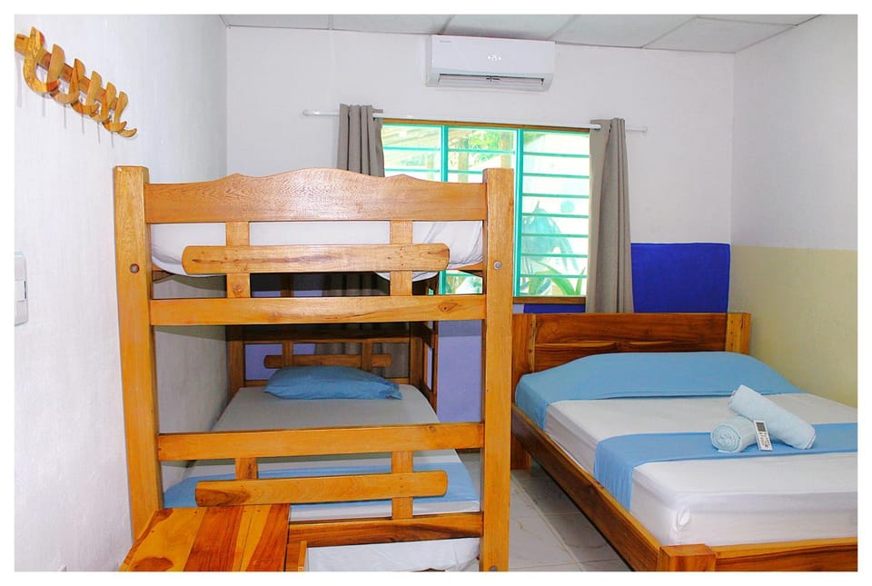 Bed, Photo of the whole room, Bedroom, bunk bed, towels, air conditioner