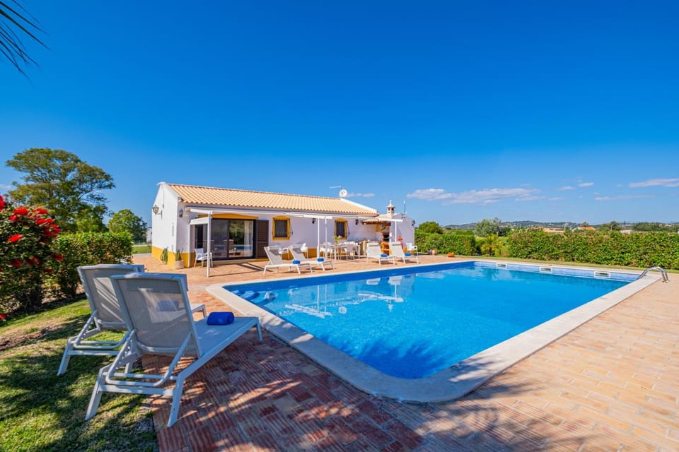 Property building, Patio, Natural landscape, Pool view, Swimming pool, sunbed